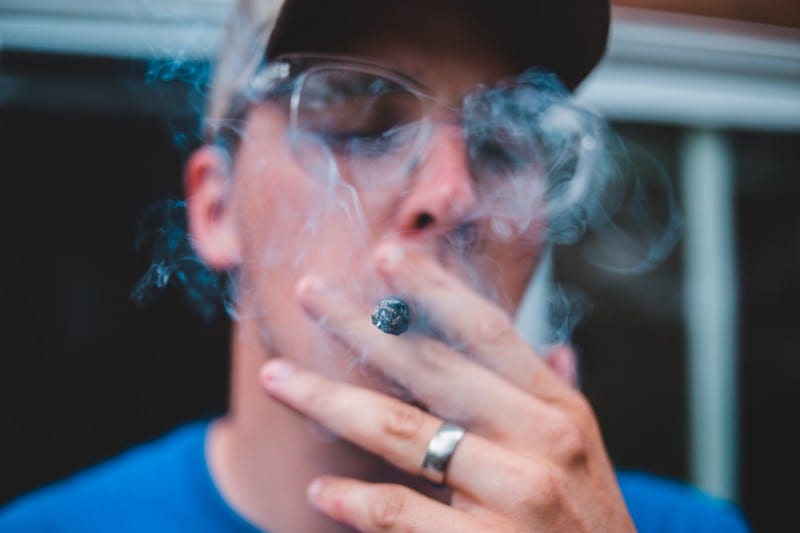 Man in glasses smoking