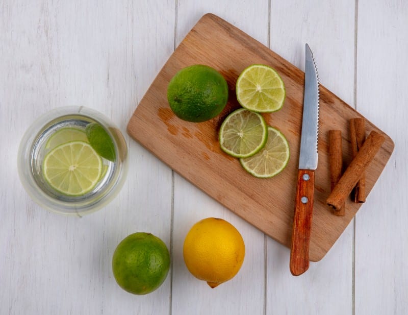 Top view of lemons on a wooden board