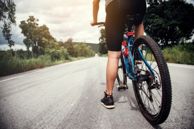 Man standing on a cycle